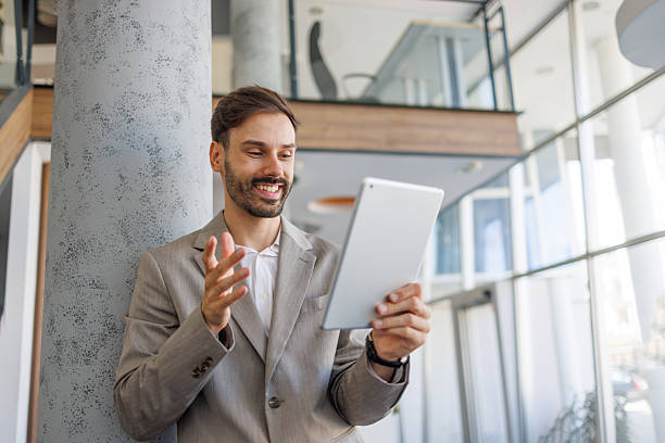 istock Businessman having a video call in modern office 2236596499