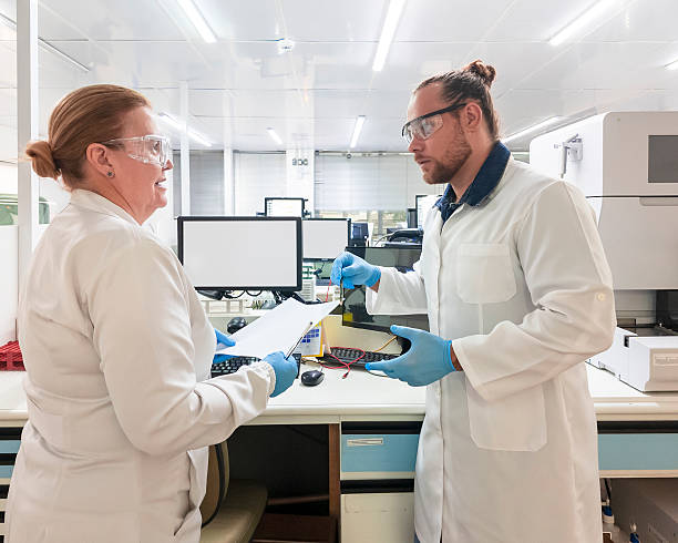 istock Scientists Discussing Research in Modern Laboratory 2236596682