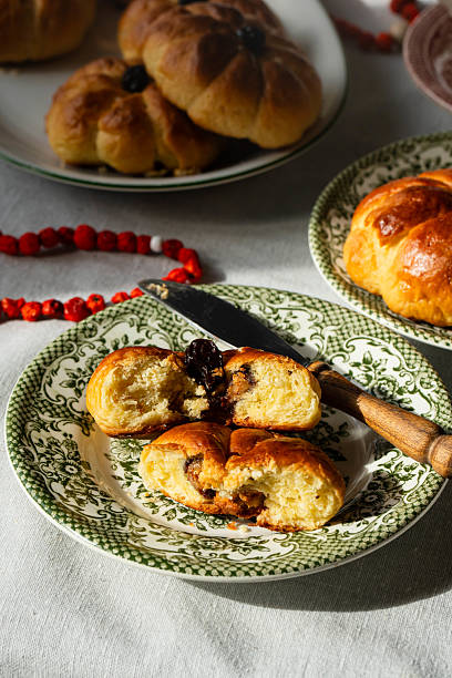 istock Pumpkin shaped buns on vintage plates. 2236596849