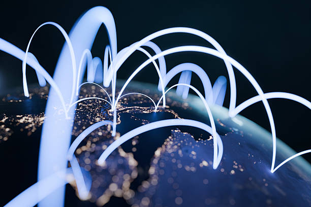 istock Glowing Earth at night with illuminated cities and digital blue light lines, representing global technology, internet connections, worldwide communication, and modern networking. Business and finance 2236603314
