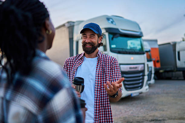 istock Truck drivers talking and smiling during coffee break 2236605710