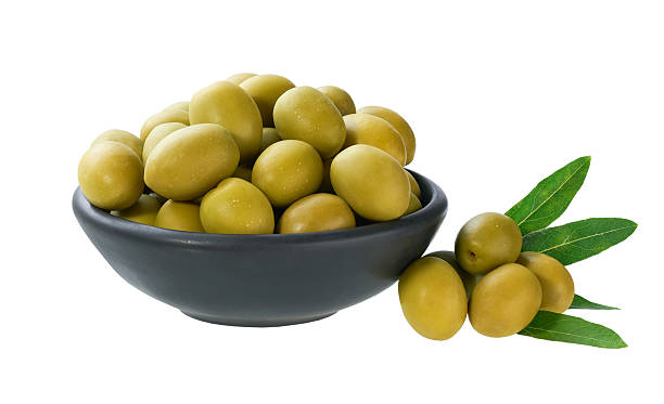 istock marinated green olives in a black ceramic bowl isolated on a white background. 2236608127