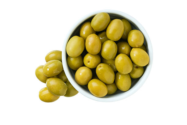 istock marinated green olives in a white ceramic bowl isolated on a white background. Top view. 2236608152