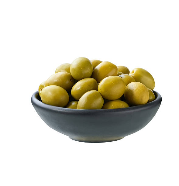 istock black bowl with pickled green olives isolated on a white background. 2236608361