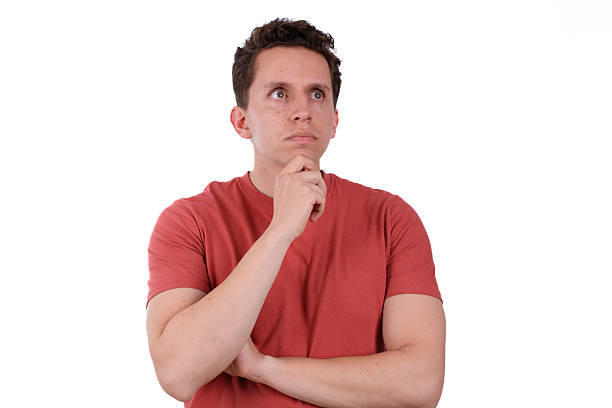 istock Thoughtful man analyzing with red shirt on white background, looking to the right 2236610508