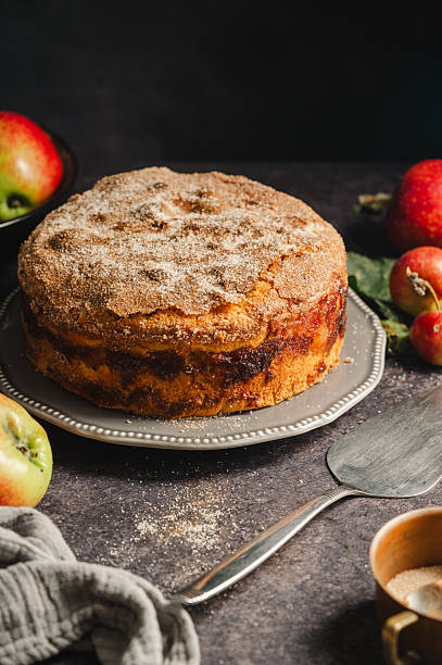 istock Homemade apple cake with cinnamon on cake stand 2236612225