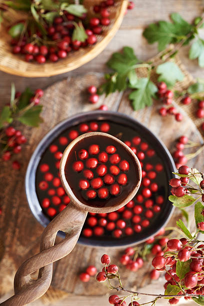 istock Preparation of medicinal wine from fresh hawthorn berries 2236612252