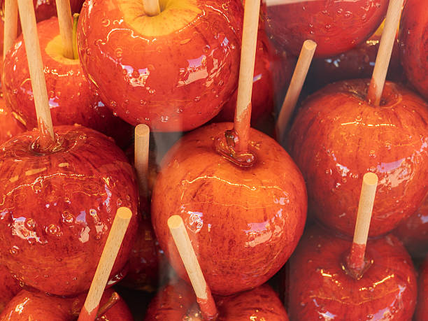 Deliciously Sweet and Glossy Caramel Apples Displayed