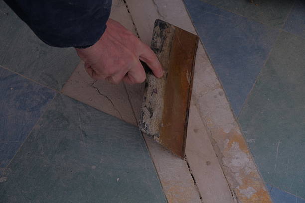 istock The man is engaged in repairs, works with a drill and other tools, hands and objects for repair are visible 2236624820