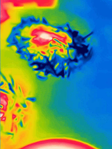 A thermal image captured by an infrared imager visualizes invisible infrared radiation, translating it into a visible color spectrum picture. It displays temperature variations across a surface, where warmer areas typically appear in reds and yellows, and cooler regions in purples and blues. Here is the oven under IR camera