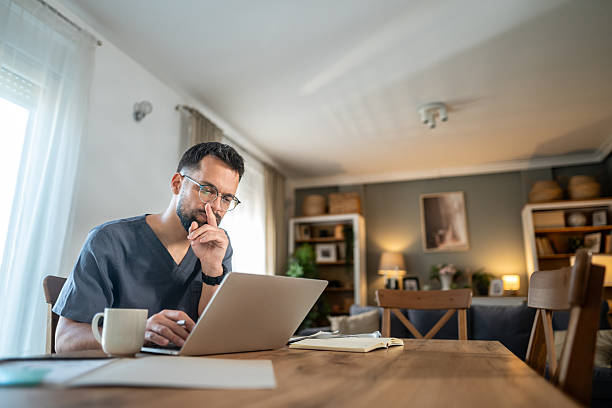 istock Doctor working from home using laptop for telemedicine consultation 2236633769