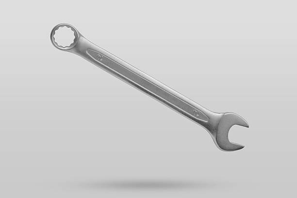 Wrench fly over gray background close up
