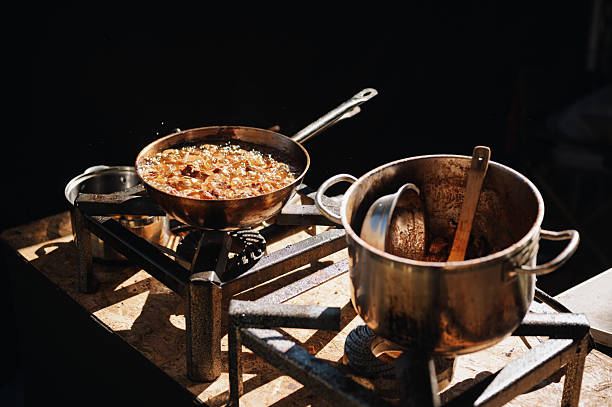 Outdoor cooking. Frying food.