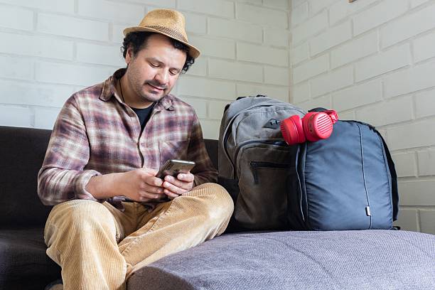 istock man sitting down plans to travel 2236641975