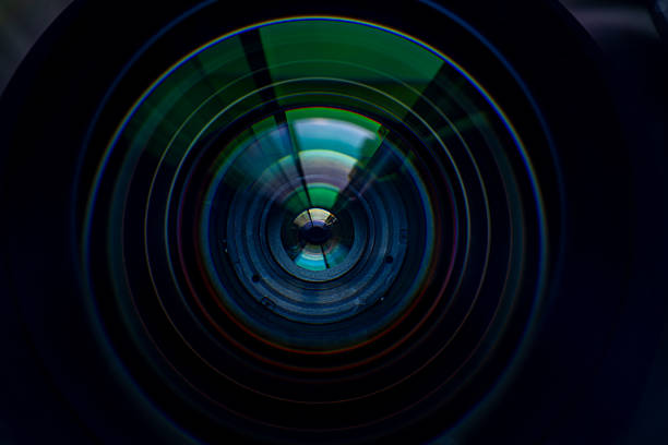 istock Close-up macro digital camera lens,Photo or video camera lens with light reflections close-up on the black background. 2236642123