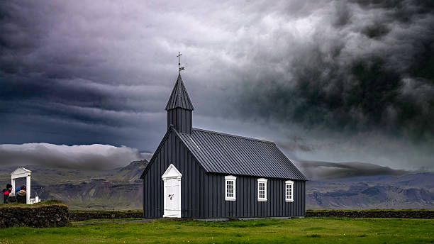 istock Black Church Under Stormy Skies 2236644126