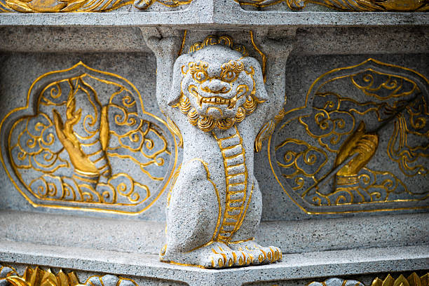 istock Stone dragon statue with golden colored ornaments 2236647168
