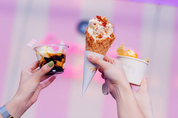 istock Three Hands Holding a Variety of Ice Cream Desserts 2236649413