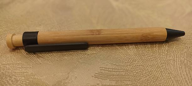 istock pen made from wood on the table 2236650347