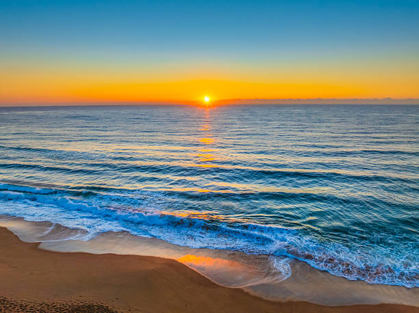 istock Sunrise at the Seaside with Clear Blue Skies 2236650651