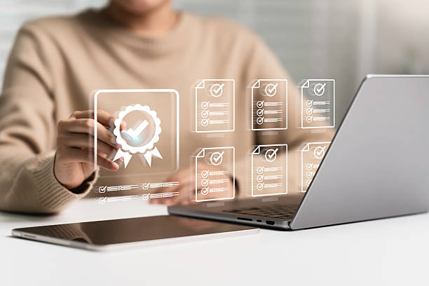 istock Quality Certificate, assurance, and Checklist document to quality control and management. Businessman tick checkmark on assurance icon, Compliance to regulations service and standards. 2236650842