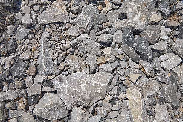 Rough gray stone fragments and rubble creating a natural geology background