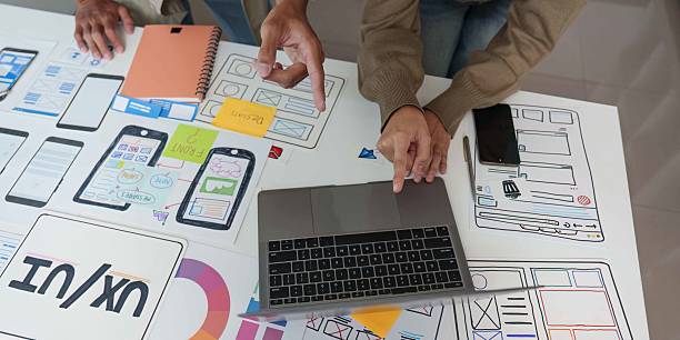 istock Collaborative UX UI Design Session with Laptop and Sketches 2236651894