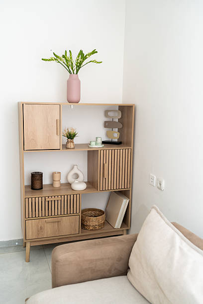 istock Modern Wooden Shelving Unit in a Bright Living Room Space 2236653326