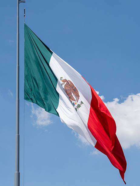 istock A mexican flag with a green background and a red and white eagle on it. Decoration to celebrate Independence Day in Mexico, zocalo 2236653943