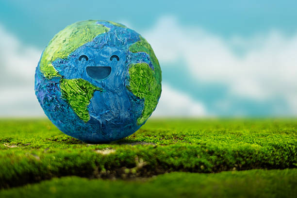 istock Earth Day, Smiling Green Globe on Green Nature background. Environmental sustainability, global ecological care and Healthy planet 2236654021