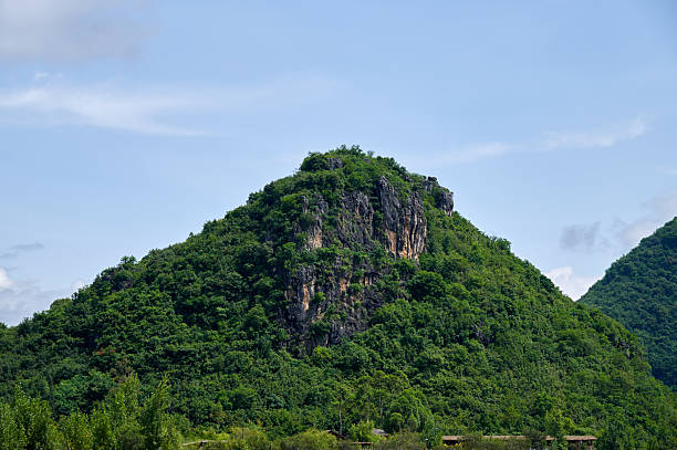 istock Lush green karst mountain landscape under blue sky 2236654260