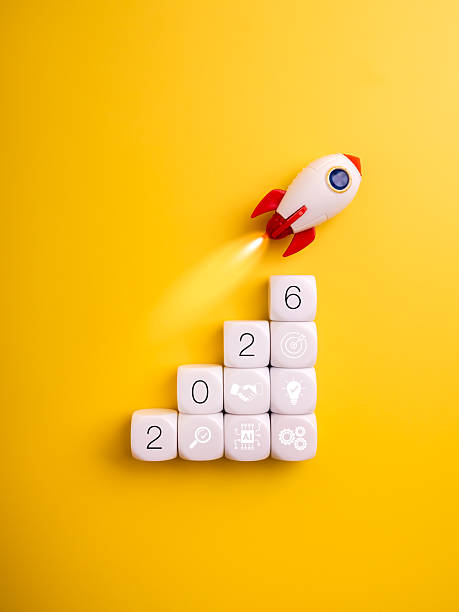 istock Business startup growth concept with rocket launching from cubes showing new year 2026 numbers and icons, symbolizing innovation, success, entrepreneurship and future development on yellow background. 2236656286