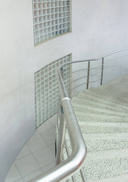 stainless steel balustrade on staircase, glass block bricks on modern interior design architecture