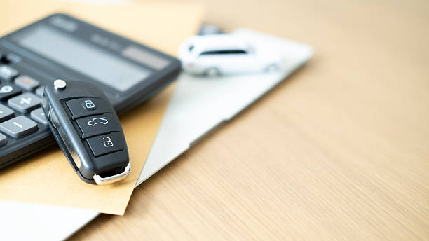 istock Black car key with calculator and toy car on documents representing auto loan calculation car insurance financial planning vehicle investment and transportation security. 2236658344