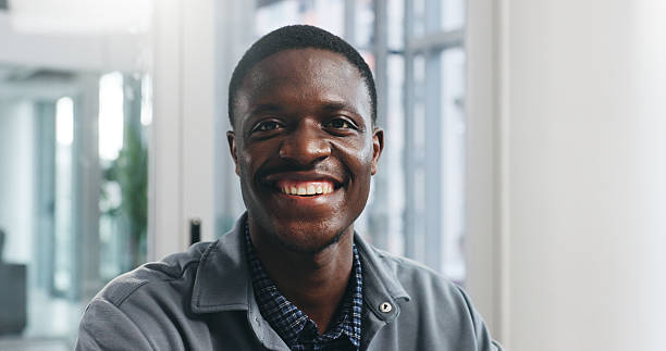 istock Portrait, smile and tech support with black man in office for IT consulting or network administration. Cybersecurity, engineering and maintenance with happy African employee in workplace for service 2236662643