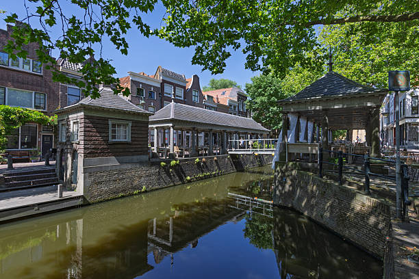 istock A unique canal view Visbank featuring charming waterside structures with seating areas in Gouda Holland. 2236665754