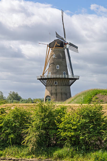 istock The impressive De Hoop windmill on a dike in Gorinchem, Netherlands. 2236666422