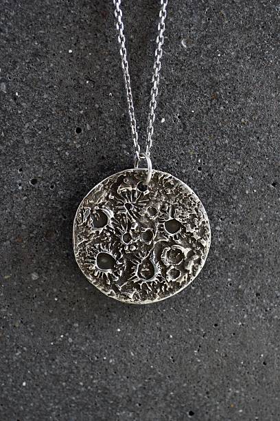 istock Textured Silver Lunar Pendant. Artistic Jewelry, Celestial Charm, Moon Inspired Design. 2236667914