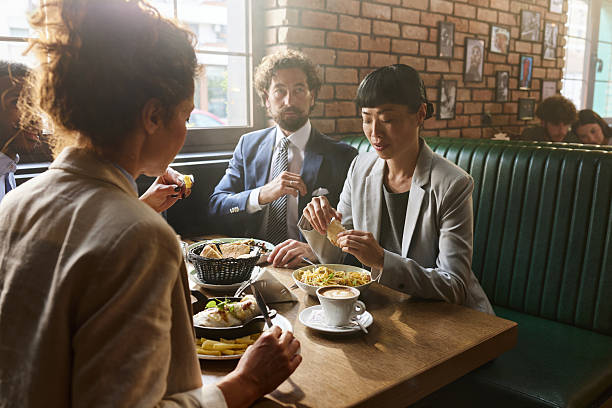 istock Business colleagues having lunch in a restaurant. 2236668538