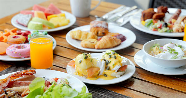 istock Luxurious breakfast spread featuring fresh fruits, pastries, eggs 2236668637