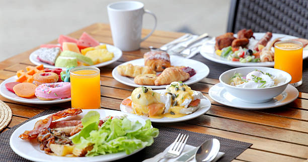 istock Luxurious breakfast table outdoor setting with fresh juice, eggs 2236668686