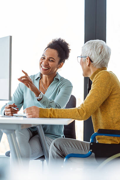 istock Mentorship and diversity in a modern office as colleagues share a laptop for team collaboration 2236670978