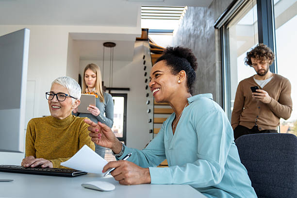 istock Business solutions, technology and strategy concept. Colleagues working and brainstorming in office 2236671121