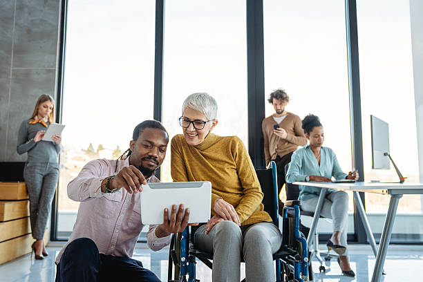 istock A bright, contemporary office space with a diverse group of professionals working together 2236671362
