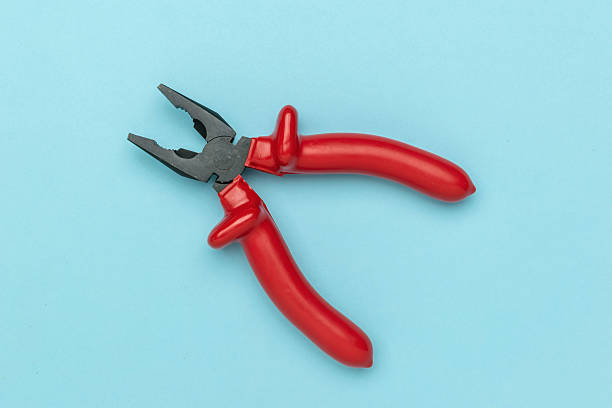 istock Red Handled Pliers on Blue Background: Essential Tool for DIY and Home Repair Projects 2236672388