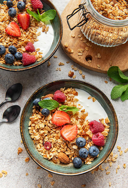 istock Granola bowls with yogurt, berries, and mint for breakfast 2236679281