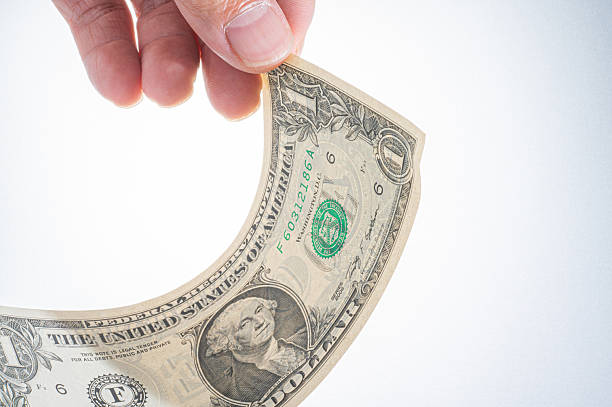 istock Hand holding united states one dollar bill 2236681196
