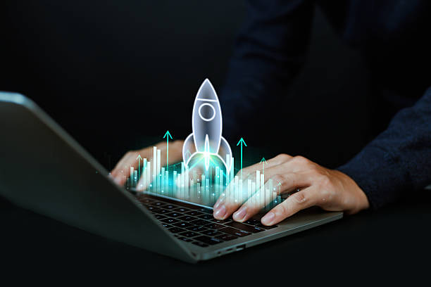 istock Businessman using laptop with digital rocket launch and growth chart, concept of startup innovation, business success, financial growth, investment strategy, and technology development. 2236685105