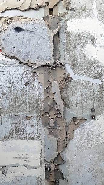 istock Close up Under construction, demolishing, showing peeling texture of existing plaster wall, abstract, arts, for background or backdrop for wallpaper or copy space, vertical 2236685781