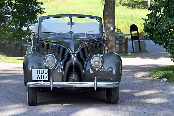 Uppsala, Sweden - July 11, 2023: Ford Club Cabriolet from 1938 in a classic car cavalcade around the town Uppsala in Sweden.